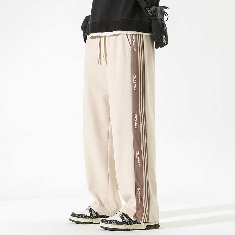 ベージュパンツ サイドライン入りゆったりパンツ